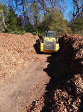 stockpiling leaves at a compost business