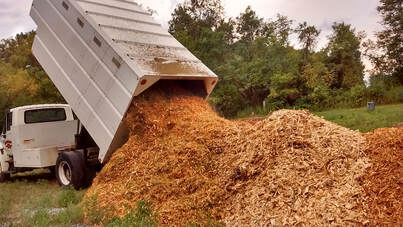 wood chips being dumped at the compost facility