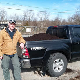 pickup truck loaded with compost