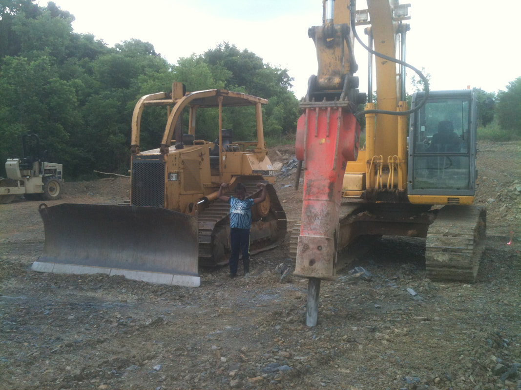 bulldozer and excavator outfitted with a breaker